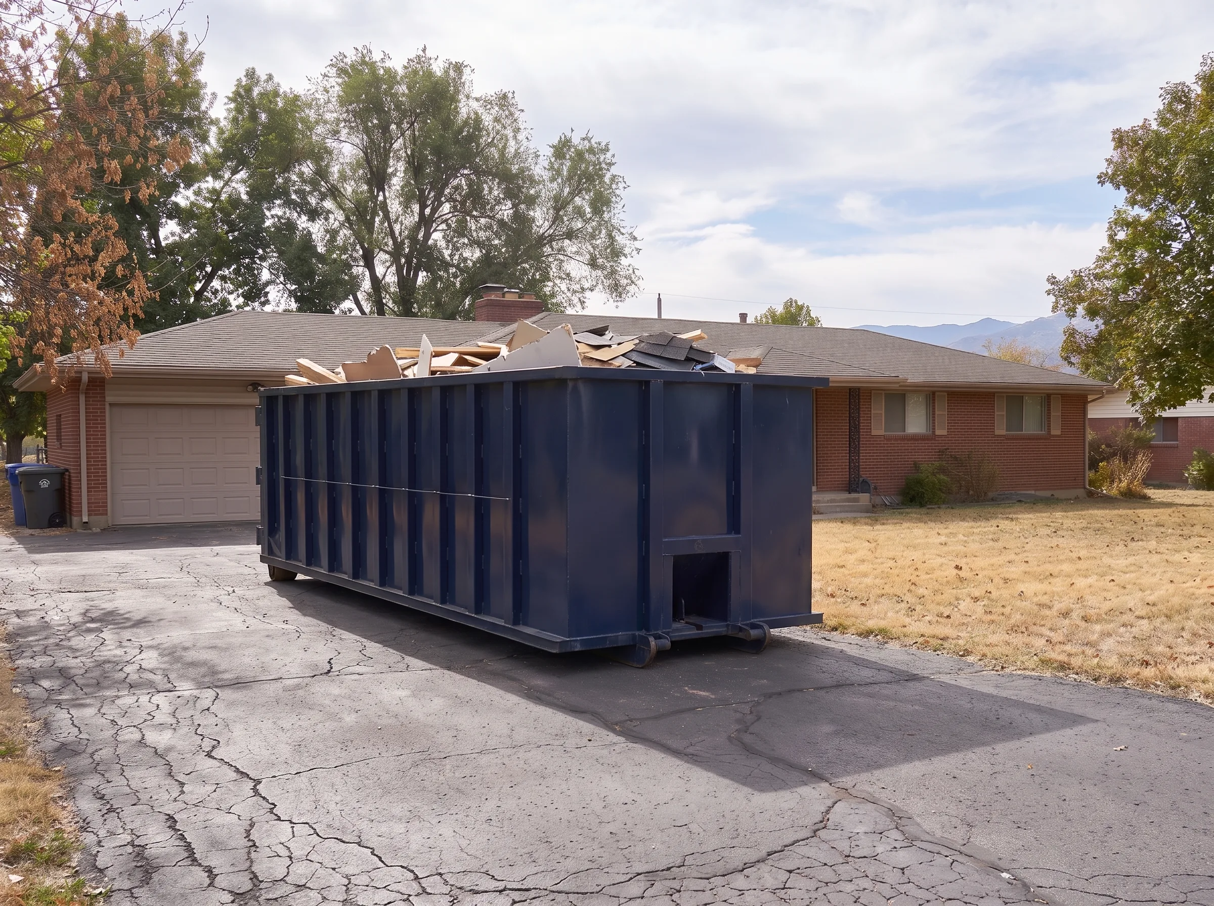 Roll-off dumpster being loaded in Carbon County, UT
